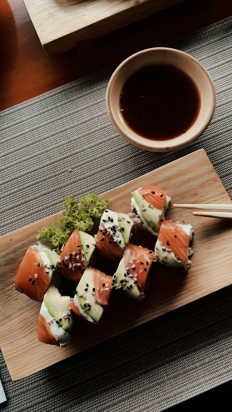 Salmon rolls on a wooden board